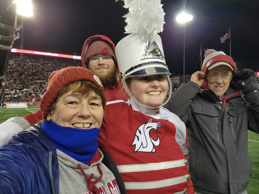 Julie McDonald Zander, Chase Conaway, Nora Zander and Larry Zander are pictured at a Washington State University football game.